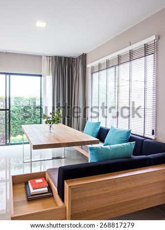 Interior design of neutral modern dining room with garden view