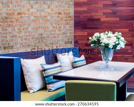 Modern dining room   interior design with seat and artificial flower vase
