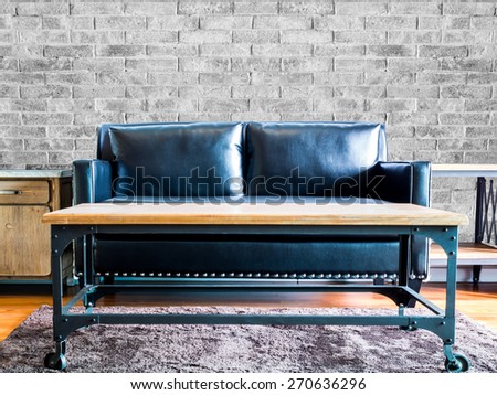 Interior design of  modern Living room with black leather couch /brick wall background