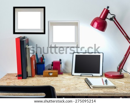 Modern creative workspace with tablet computer on compressed plywood chipboard table top