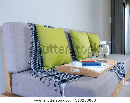 Interior design of light meal tray on couch in modern Living room/ home improvement concept