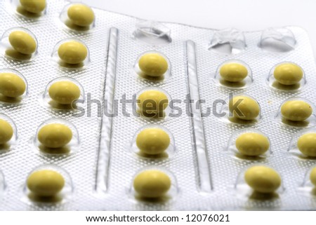 Yellow pills in silver package