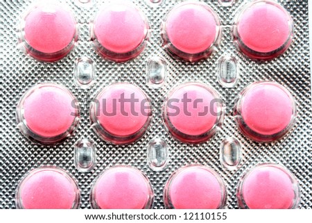 Twelve pink tablets in silver package