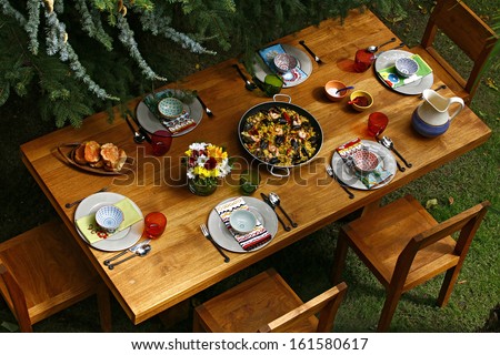 spanish style dining table with paella overview