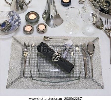 dining table setting with square glass plate, close up, overview