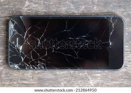 Broken phone on wooden bench