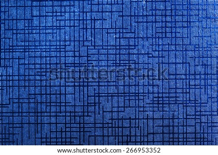 Blue shiny paper with abstract pattern close up