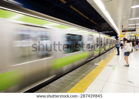 TOKYO, JAPAN - CIRCA JULY 2014: Japanese trains at a station. Train is the main method of transportation in Japan.