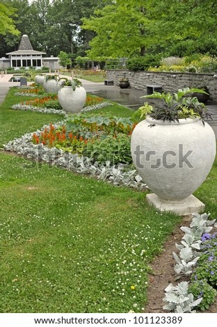 path decorated with large planters leading towards the tea house at the Royal Botanical Gardens in Burlington, Ontario