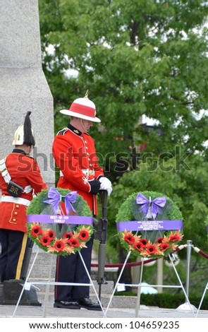 OTTAWA, ONTARIO, CANADA - MAY 31: Honor Guards standing guard at the 110th Anniversary of the South African War commemorative ceremony, National War Memorial on May 31, 2012 in Ottawa, Canada