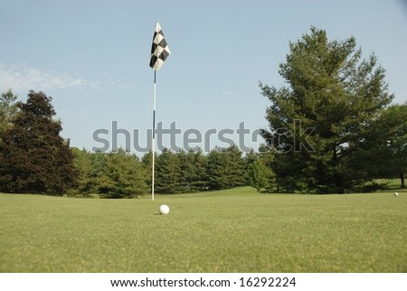 golf hole focus on the flag