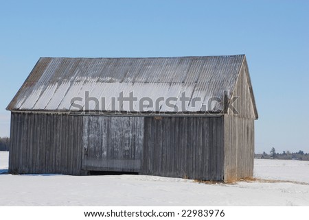 Winter barn, blue sky
