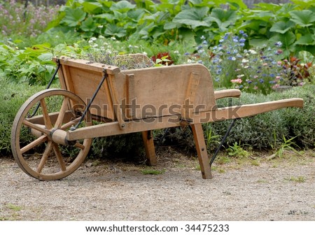 Wooden Wheelbarrow In A Garden Stock Photo 34475233 : Shutterstock