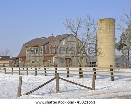 weathered grey agricultural buildings, Winter