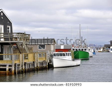east coast fishing village Fisherman Cove Eastern Passage in Nova Scotia Canada; Halifax in the background