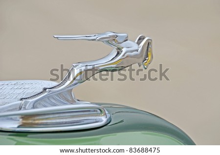 MOUNT HOPE, ON - AUGUST 14: Closeup of the hood ornament of a 1930 Chrysler Imperial car, at the Vintage Wheels and Wings show at the Hamilton Airport on August 14, 2011 in Mount Hope, Ontario
