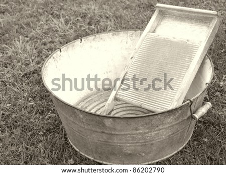 old fashioned laundry equipment, washboard and tub in vintage colors