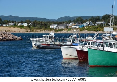 fishing boats anchored in a small cove along the Cabot Trail Cape Breton Highland park, Nova Scotia Canada