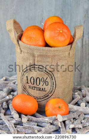 tangerines in jute bag, in the fall