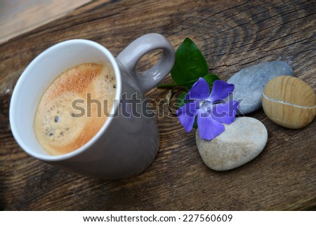 coffee on a old wood background with zen stones, coffee break