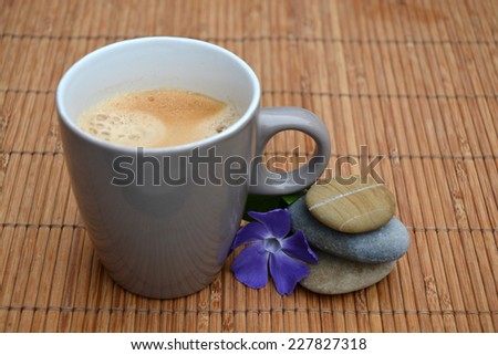 fresh coffee with zen stones on bamboo reed background