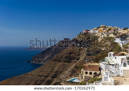 Home located on the red rocks of volcanic origin. Santorini, Greece