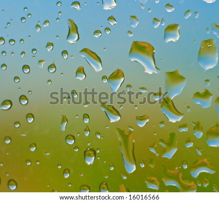 Drops of water on glass. An effective background.