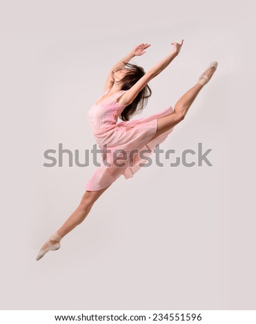 jumping professional ballet girl dancer isolated on studio background