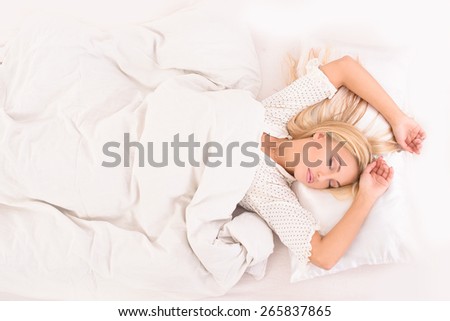 Healthy sleep. Calm girl sleeping under the covers