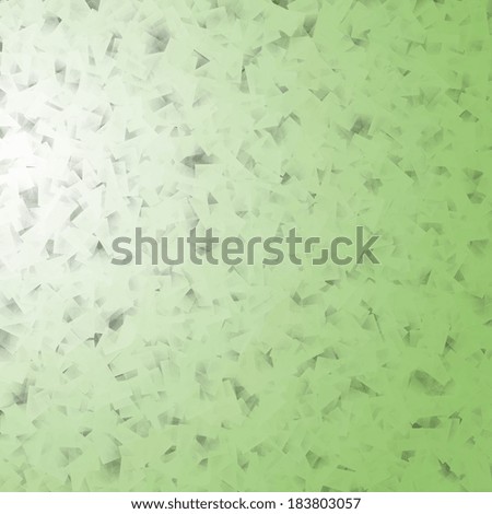 delicate green background beam of light and scraps of paper texture
