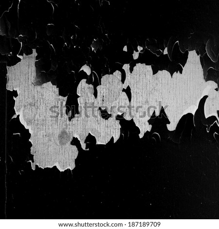 gray hole in the black painted wall as abstract background