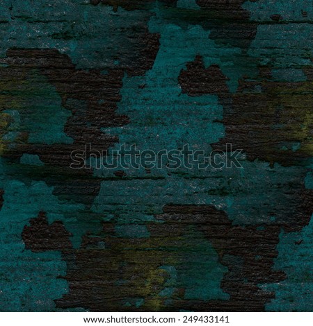peeling blue paint on the old black boards, seamless pattern