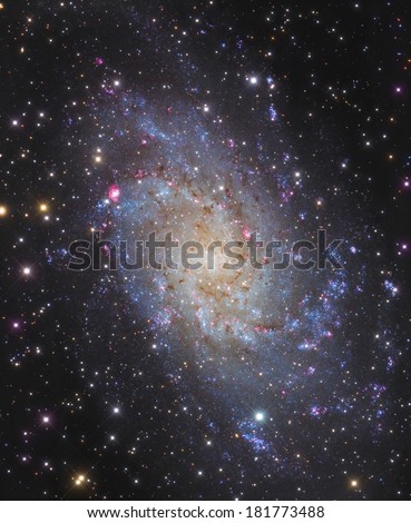 Big galaxy with stars cross-shaped. In the center of this galaxy is a massive black hole.