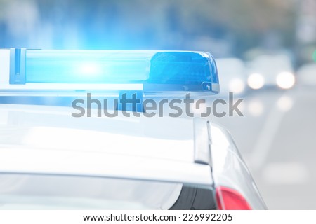 Police car with lights turned on.