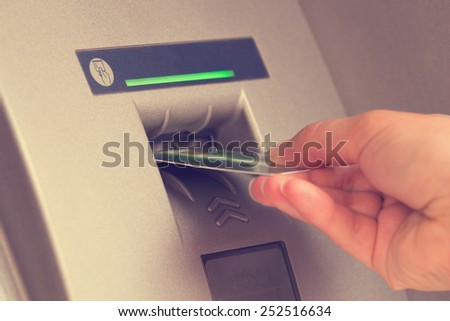 ATM cash withdrawal. Shallow DoF.