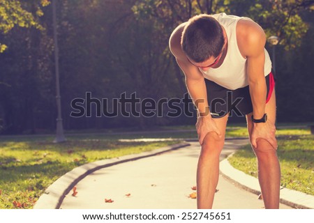 Tired jogger in the park.