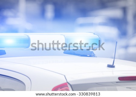Police car with lights turned on.