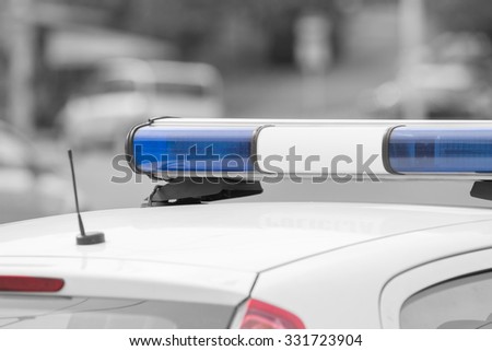 Police car with lights turned off.