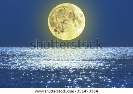 Moonrise over ocean/sea horizon. No elements of NASA or other third party. Moon is my work.