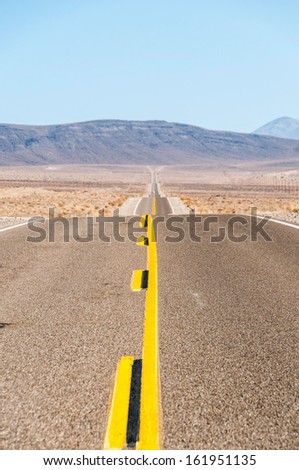 Vertical view of endless road leading to horizon.