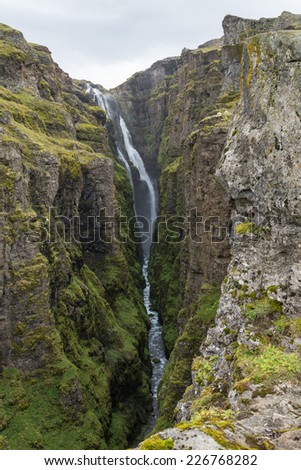 Vertical view of The Glymur Waterfall - second highest waterfall of Iceland