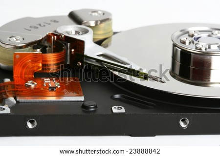 Inner workings of a hard disk, showing the disk and the magnetic head used to read and write data.