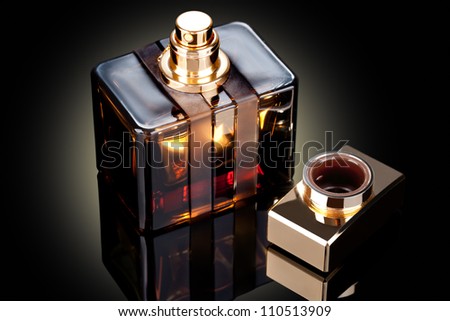 beautiful bottle of perfume on a dark background