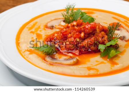pumpkin soup with coconut milk, champignon and vegetable ragout