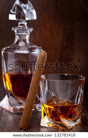 Glass of scotch whiskey on a wooden table
