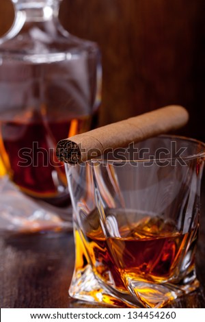 Glass of scotch whiskey on a wooden table