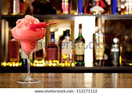 Raspberry-cream smoothie on the background of the bar