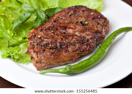pepper steak on a white plate