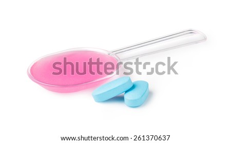 Liquid medicine on a spoon. isolated on a white background