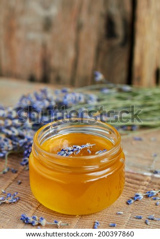 Jar of herbal honey with lavender flowers